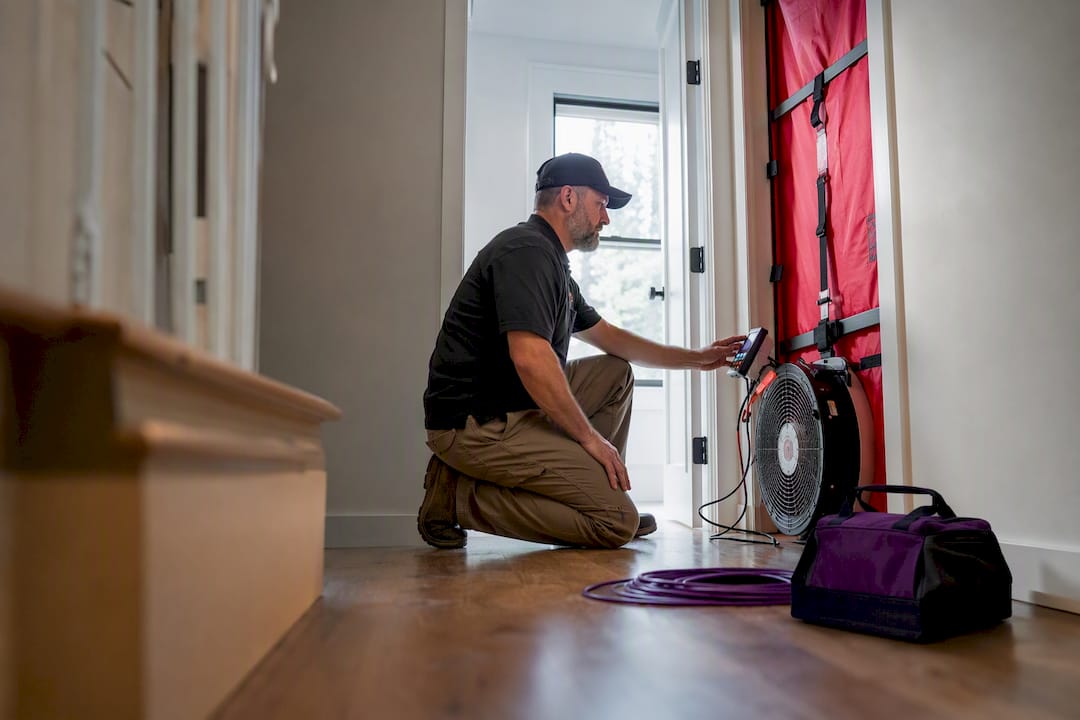 Technician operating a blower door test