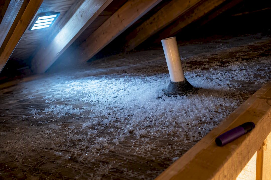 Frost clusters on attic roof sheathing
