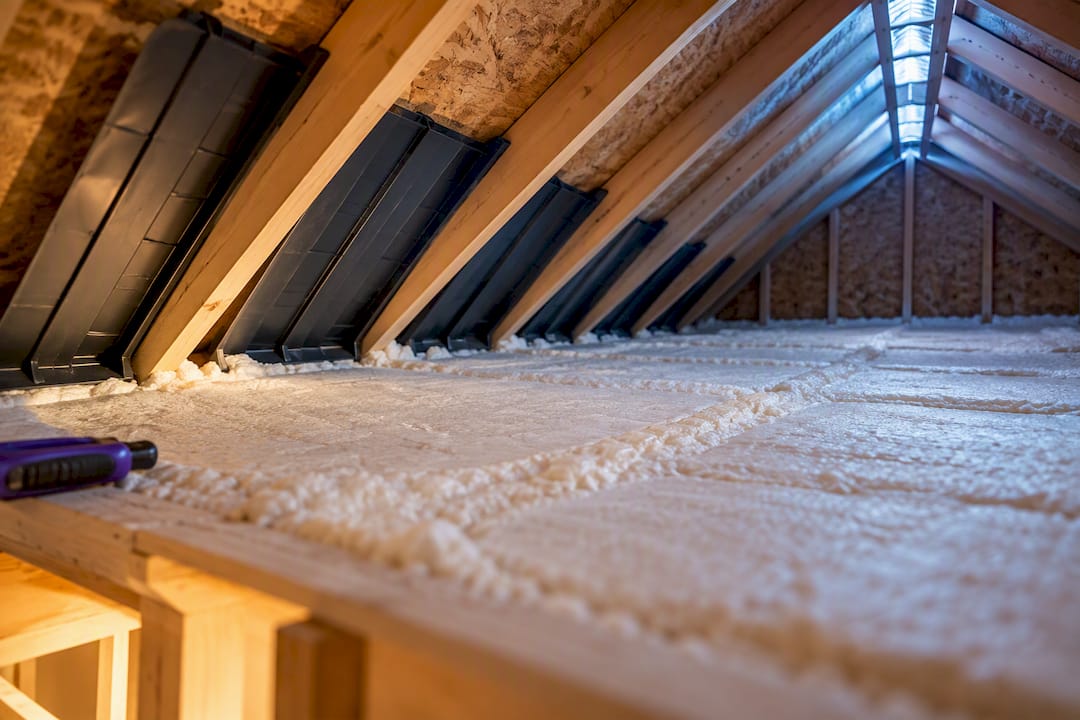 Sealed attic floor beneath clear ventilation channels