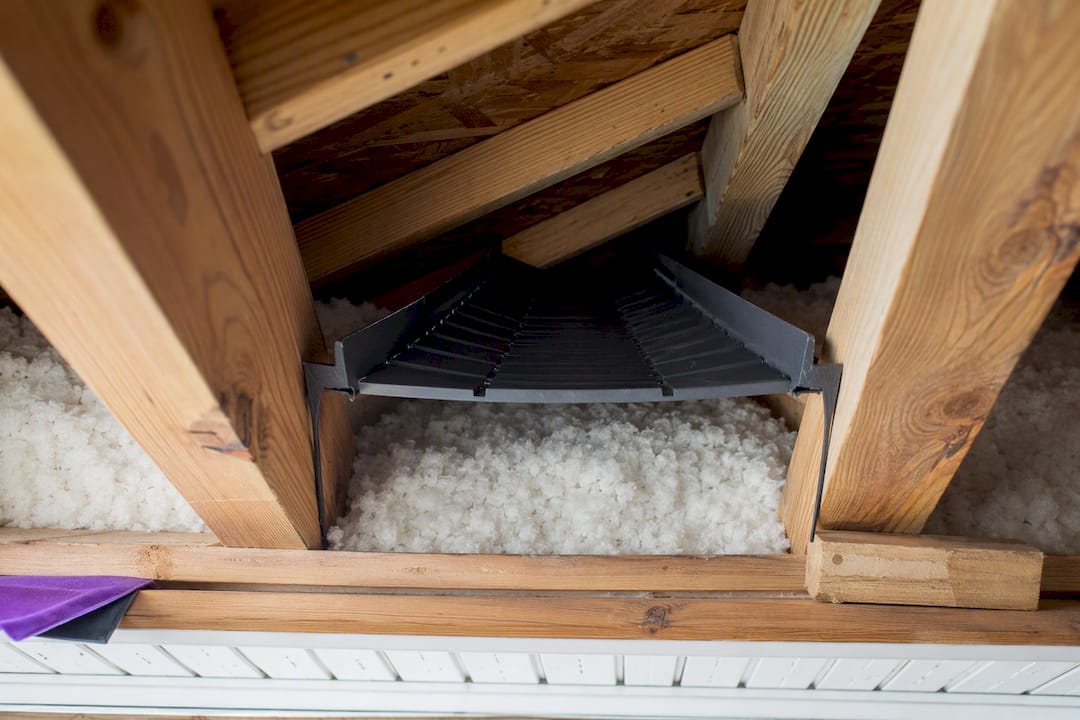 Rafter baffle maintaining attic air channel