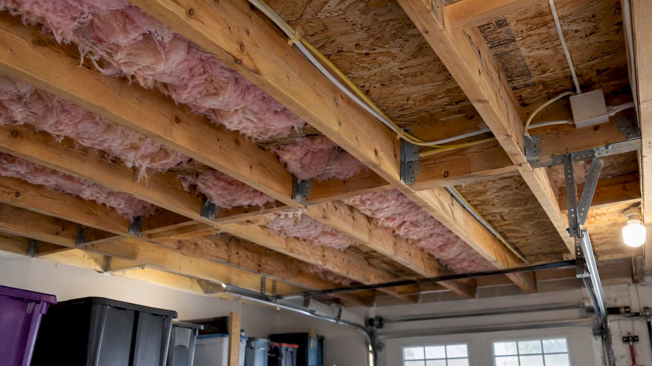 Insulation visible between garage ceiling joists